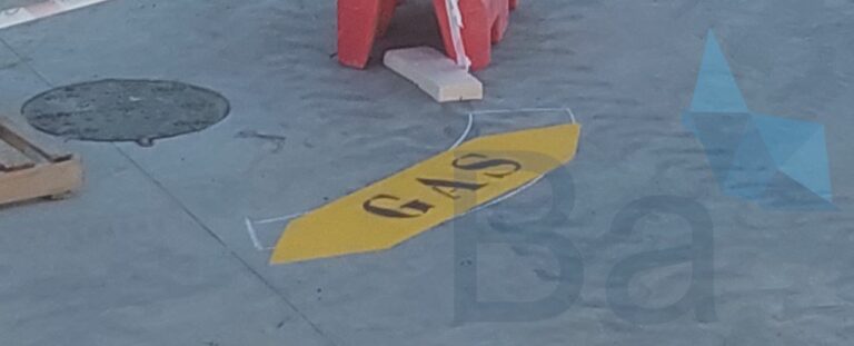 Gas marking painted on the ground to indicate underground gas route.