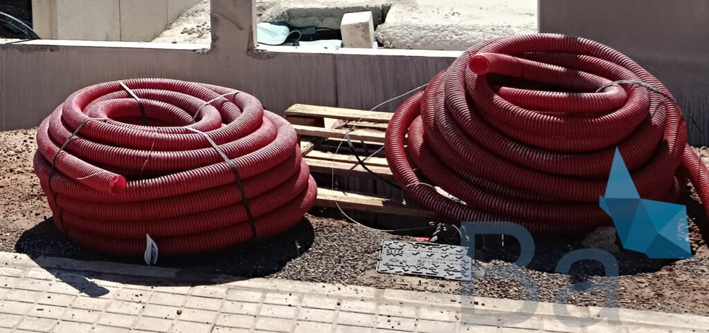 Stacked coils of corrugated polyethylene pipes