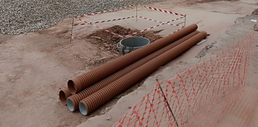 Stockpile of corrugated PVC pipes